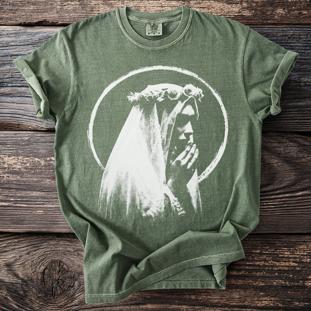 Green t-shirt with a white graphic of a person wearing a veil and flower crown.