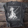 Dark gray t-shirt with graphic of Bigfoot grabbing a hot dog over a campfire and text.