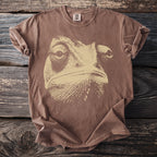 Brown short-sleeve t-shirt with a beige chameleon face graphic and Comfort Colors tag.