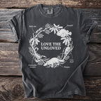 Dark grey t-shirt with "Love the Unloved" and detailed illustrations of venomous creatures.