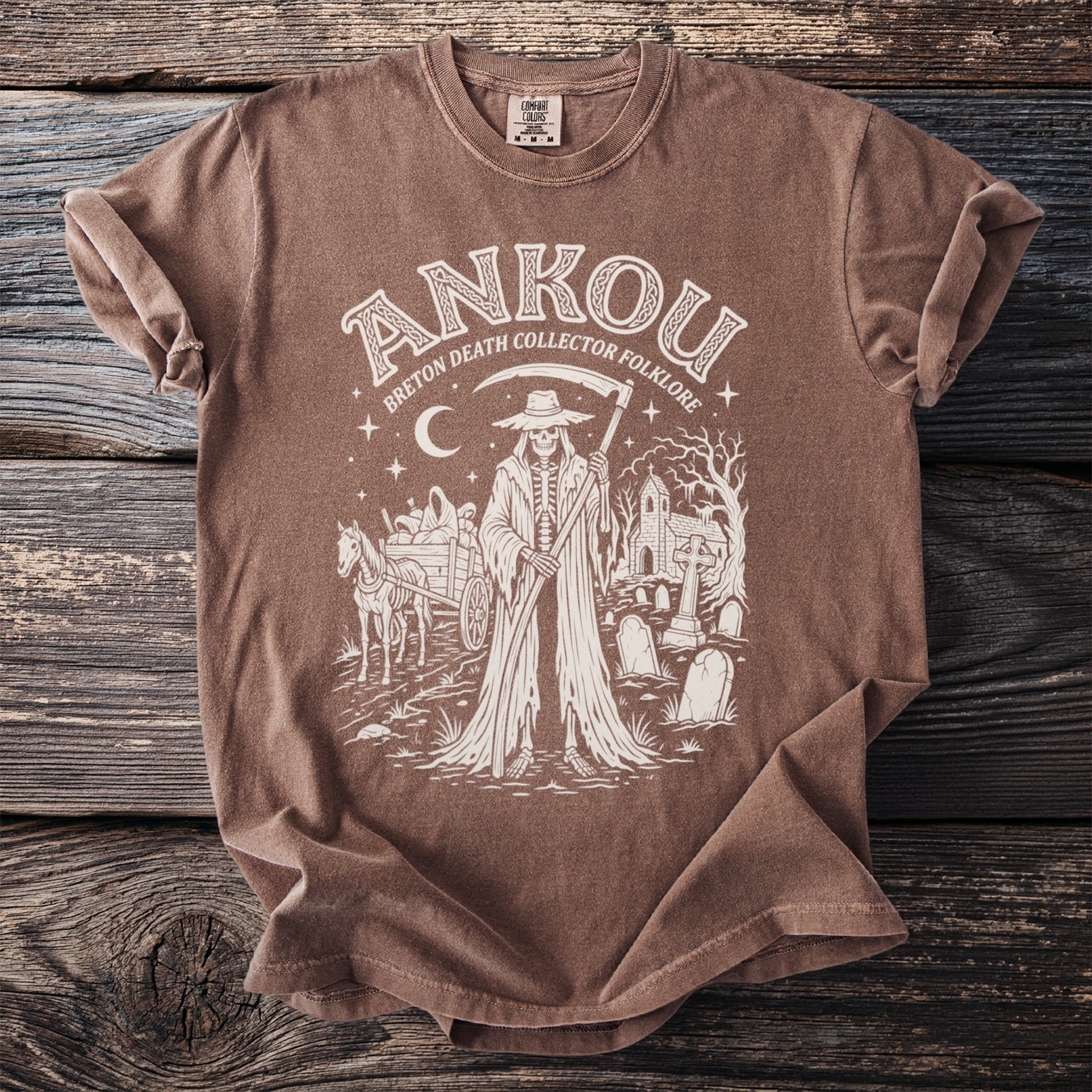 Brown t-shirt with "ANKOU Breton Death Collector Folklore" and grim reaper in a graveyard graphic.
