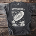 T-shirt with diagram of mitochondria labeled "MITOCHONDRIA" and "STILL TIRED."