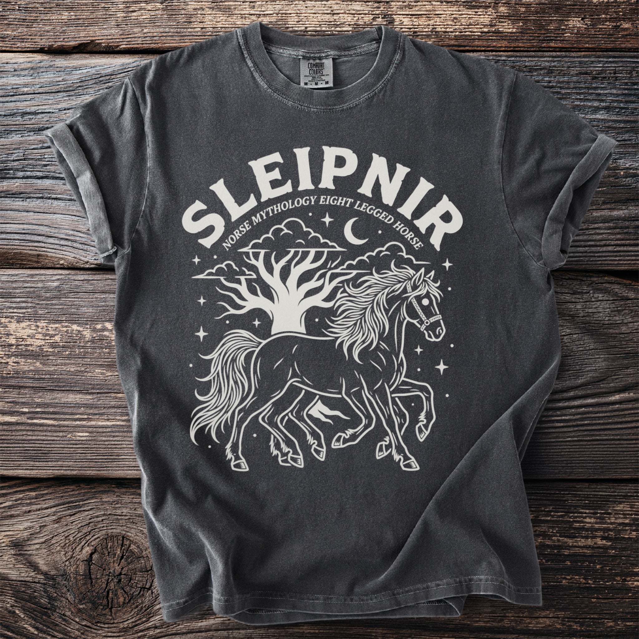 Dark gray t-shirt with white print of Sleipnir, the Norse mythology eight-legged horse, under a tree.