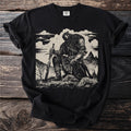 Black t-shirt with a linocut-style print of a kneeling warrior holding a sword.