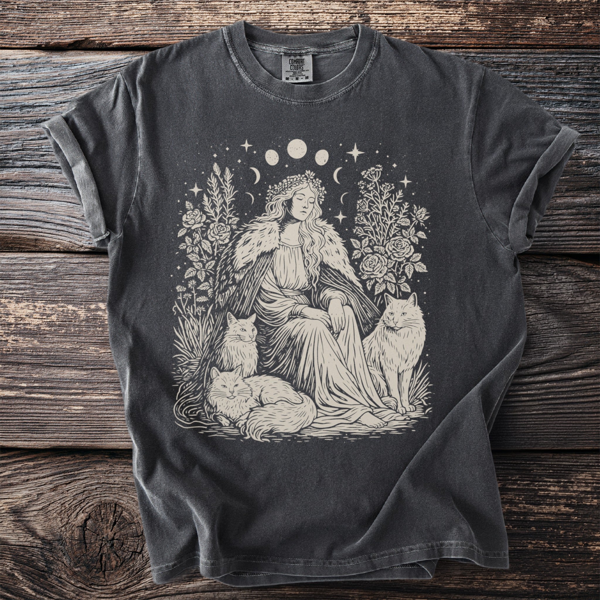 Dark gray t-shirt with woman, cats, and floral design.