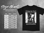 Black t-shirt with "doing my best (questionable)" graphic and size chart.