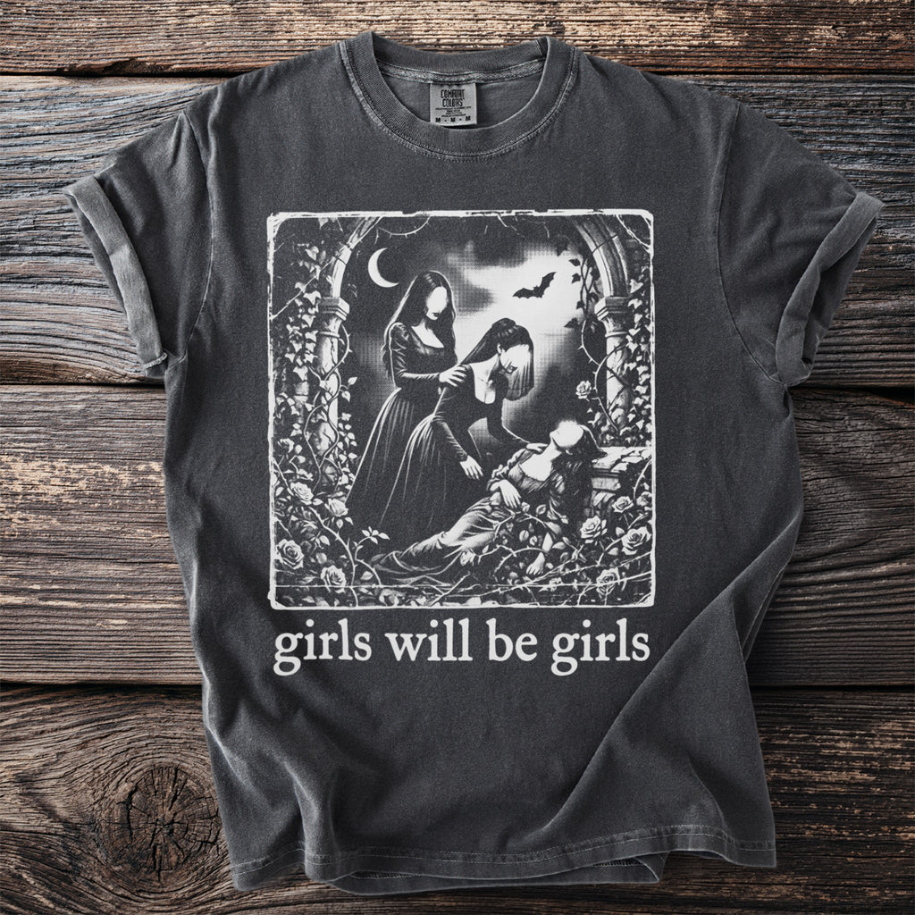 Dark t-shirt with gothic illustration and text "girls will be girls."