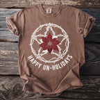 Brown t-shirt with thorns, poinsettia, star, and text "HAPPY UN-HOLIDAYS".