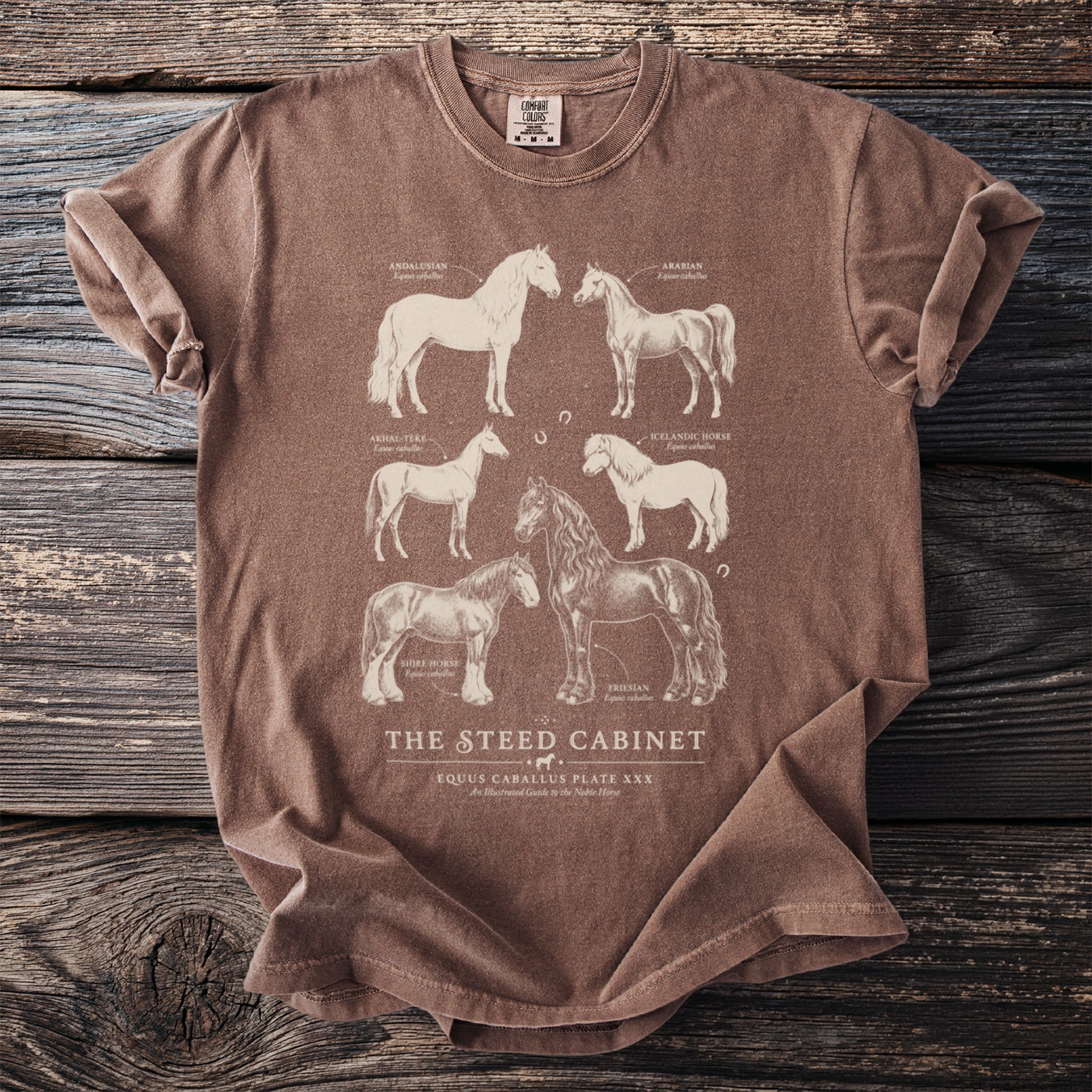 Brown t-shirt with six horse breeds illustrated on front, includes text.