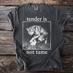 Dark grey t-shirt with a wolf and rabbit graphic and text "tender is not tame".