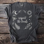 Dark grey t-shirt with "respect the locals" text and celestial nature graphics.
