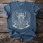 Blue t-shirt with occult artwork of three women, torches, dogs, and a moon eclipse.
