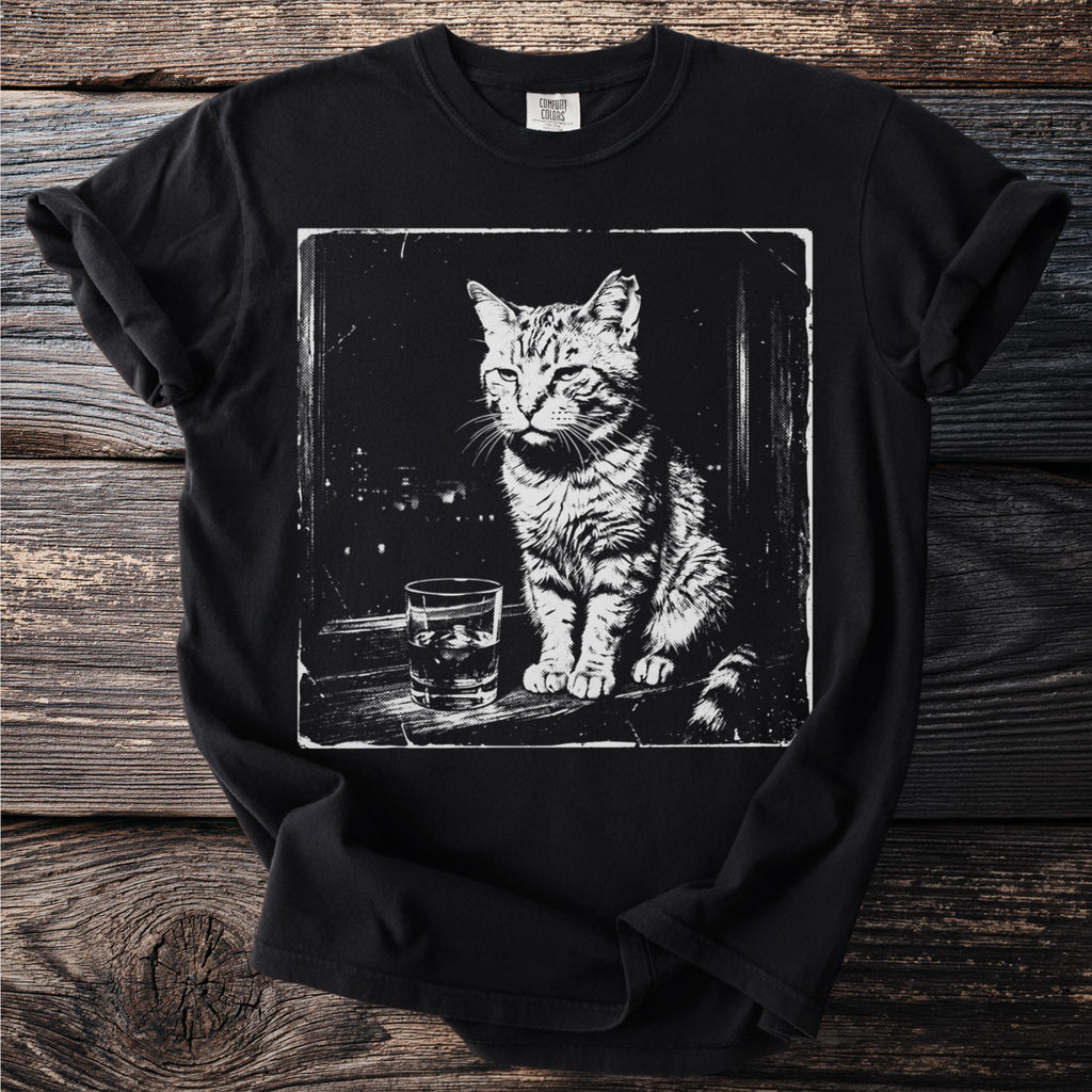 Black t-shirt with a distressed graphic of a cat sitting next to a glass of ice.