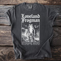 Dark gray t-shirt with Loveland Frogman graphic and text.