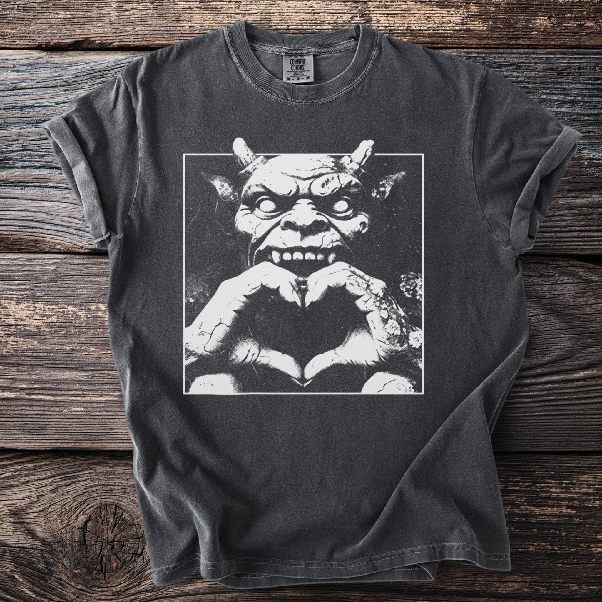 Dark gray t-shirt with a white graphic of a monster making a heart shape.