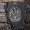 Dark t-shirt with a graphic of robed figures dancing around a bonfire under a moon.