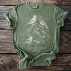 Green t-shirt with vintage-style illustration of various corvid birds and text.
