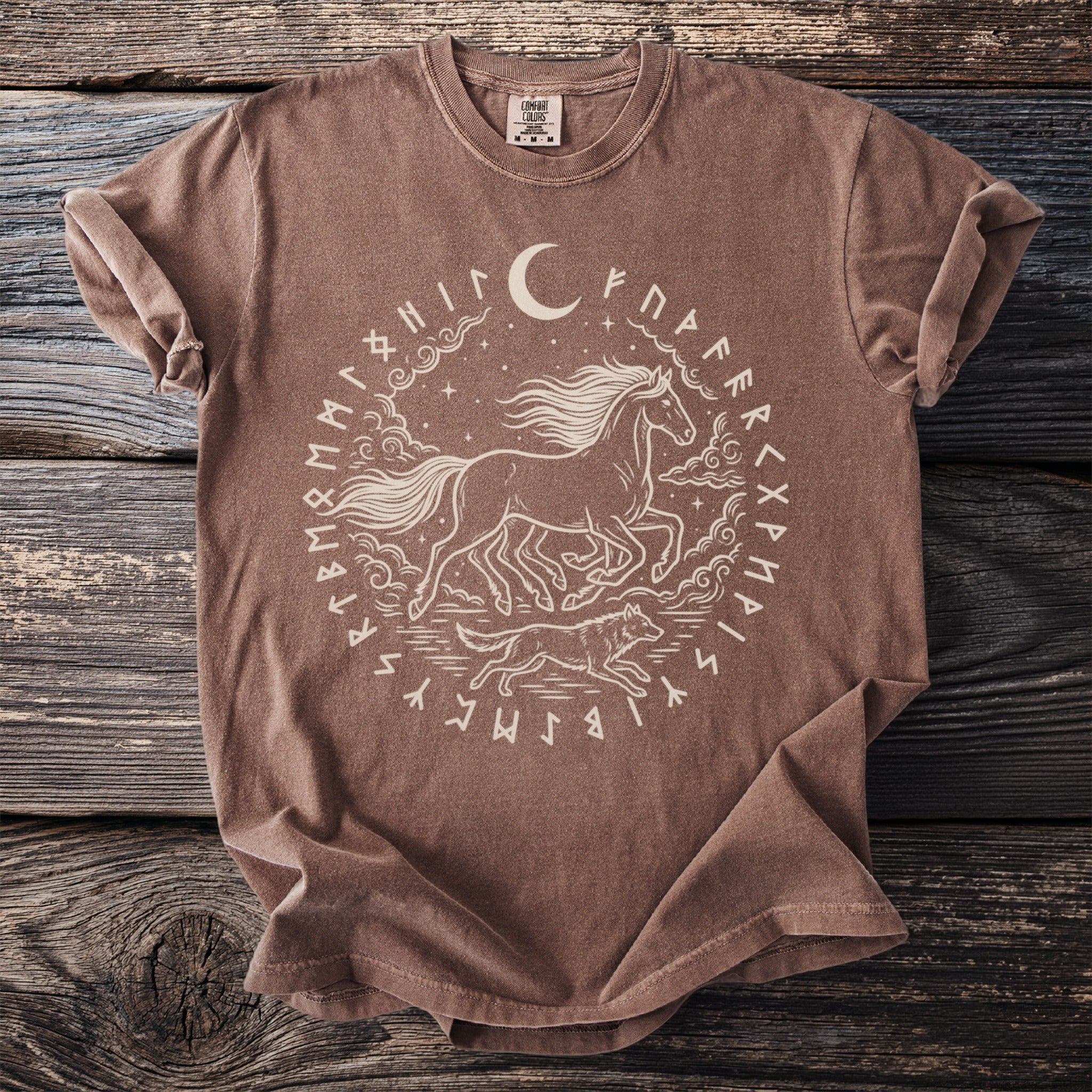 Brown t-shirt with circular design of horse, wolf, moon, stars, and runes.