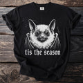 Black t-shirt with a white graphic of a bat and the text "tis the season".