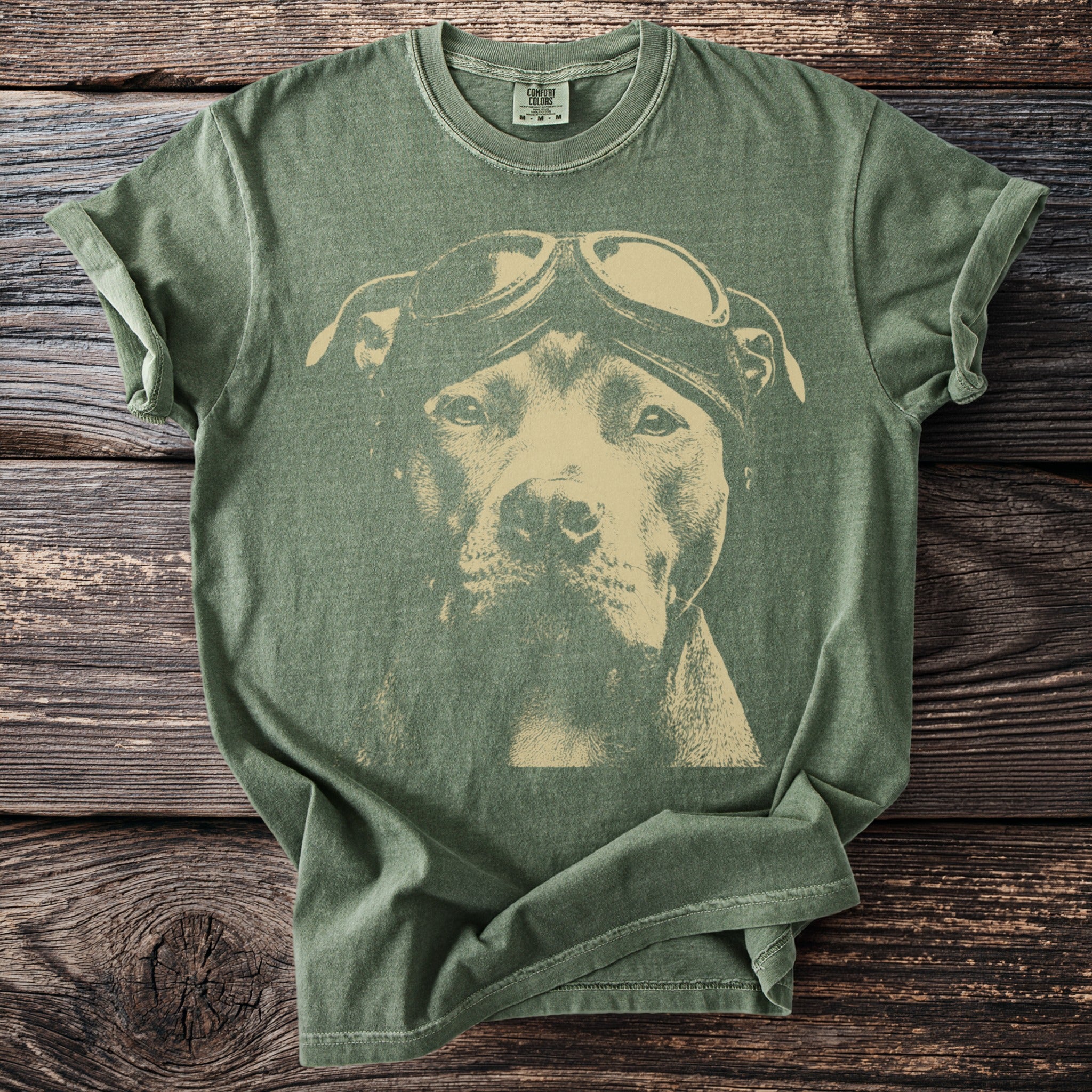Green t-shirt with a graphic of a pit bull wearing aviator goggles.