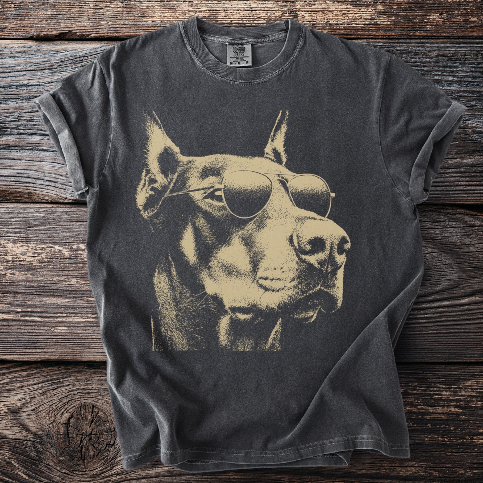 Dark gray t-shirt featuring a sepia tone graphic of a Doberman wearing aviator sunglasses.