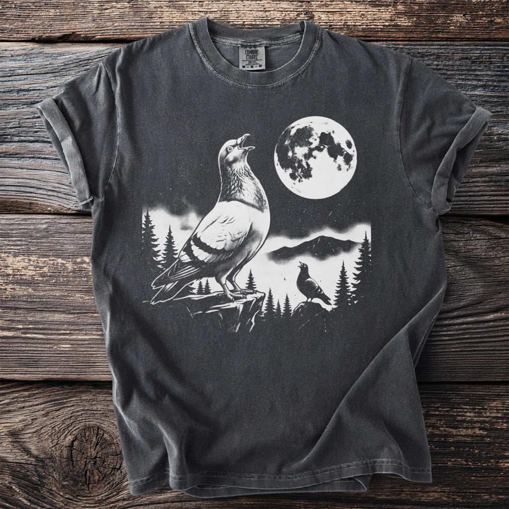 Dark t-shirt with a graphic of pigeons on a cliff under a full moon.