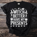 Black t-shirt with white text "WITCH BETTER HAVE MY PRESENTS" and Halloween graphics.