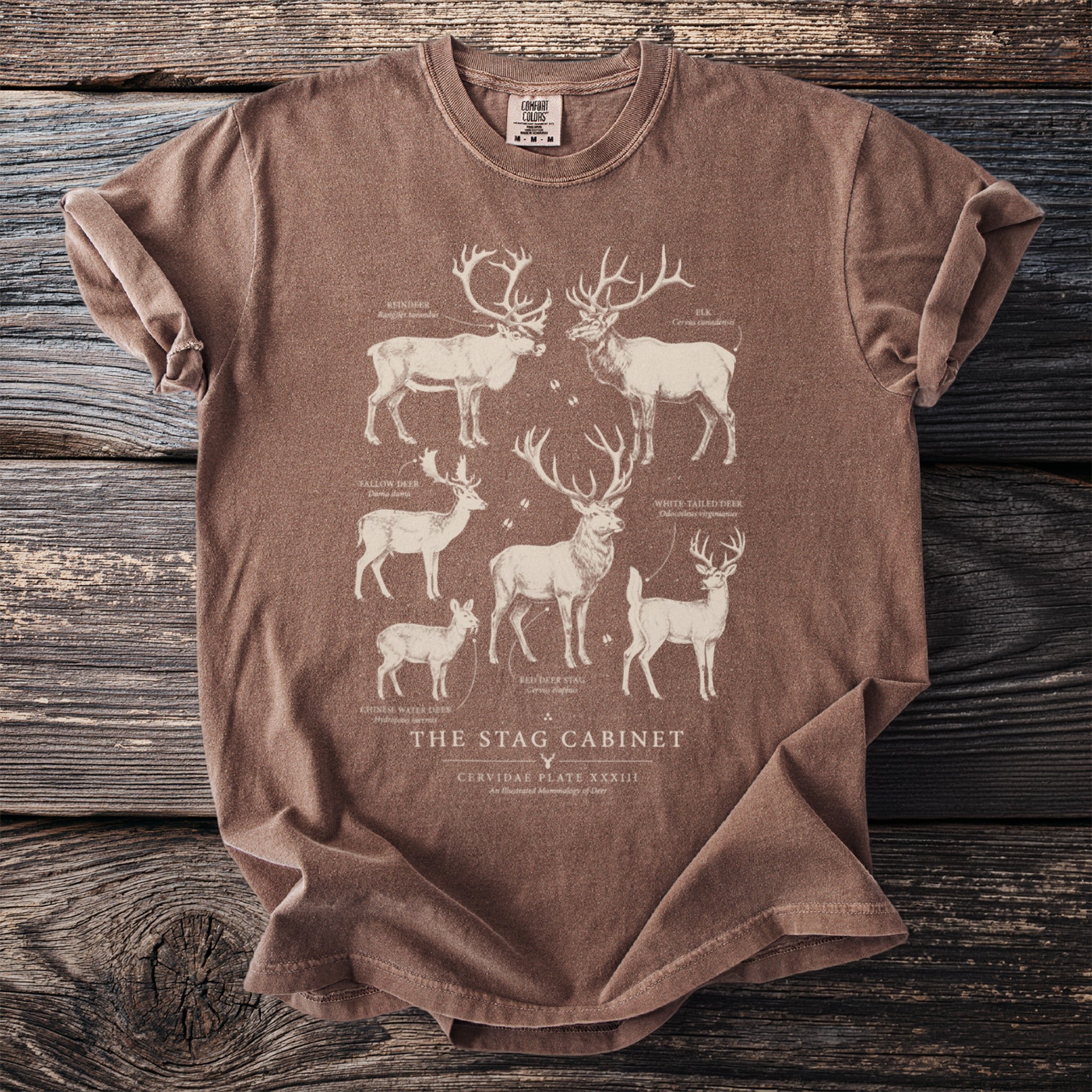 Brown t-shirt with "The Stag Cabinet" and illustrations of various deer species.