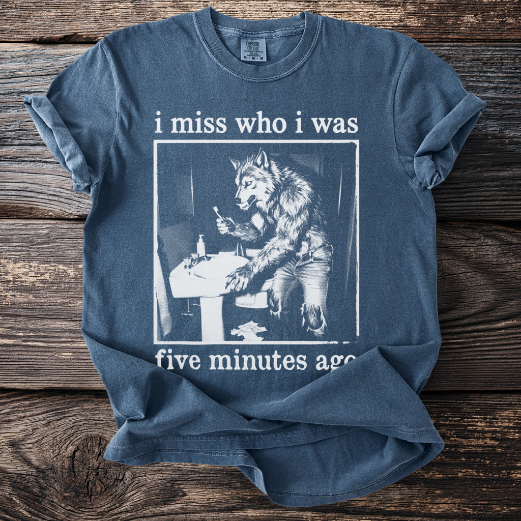 T-shirt with werewolf at sink graphic and "i miss who i was five minutes ago" text.
