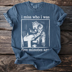 T-shirt with werewolf at sink graphic and "i miss who i was five minutes ago" text.