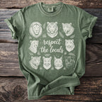 Green t-shirt with white illustrations of big cats and text "respect the locals."