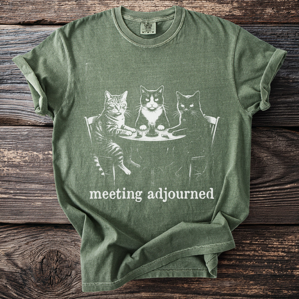 Green t-shirt with three cats at a table, text "meeting adjourned".