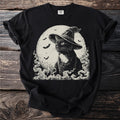 Black cat in a witch hat with bats and full moon, surrounded by smoky wisps.