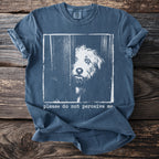 Blue t-shirt with a distressed graphic of a dog peeking through a gap and text.