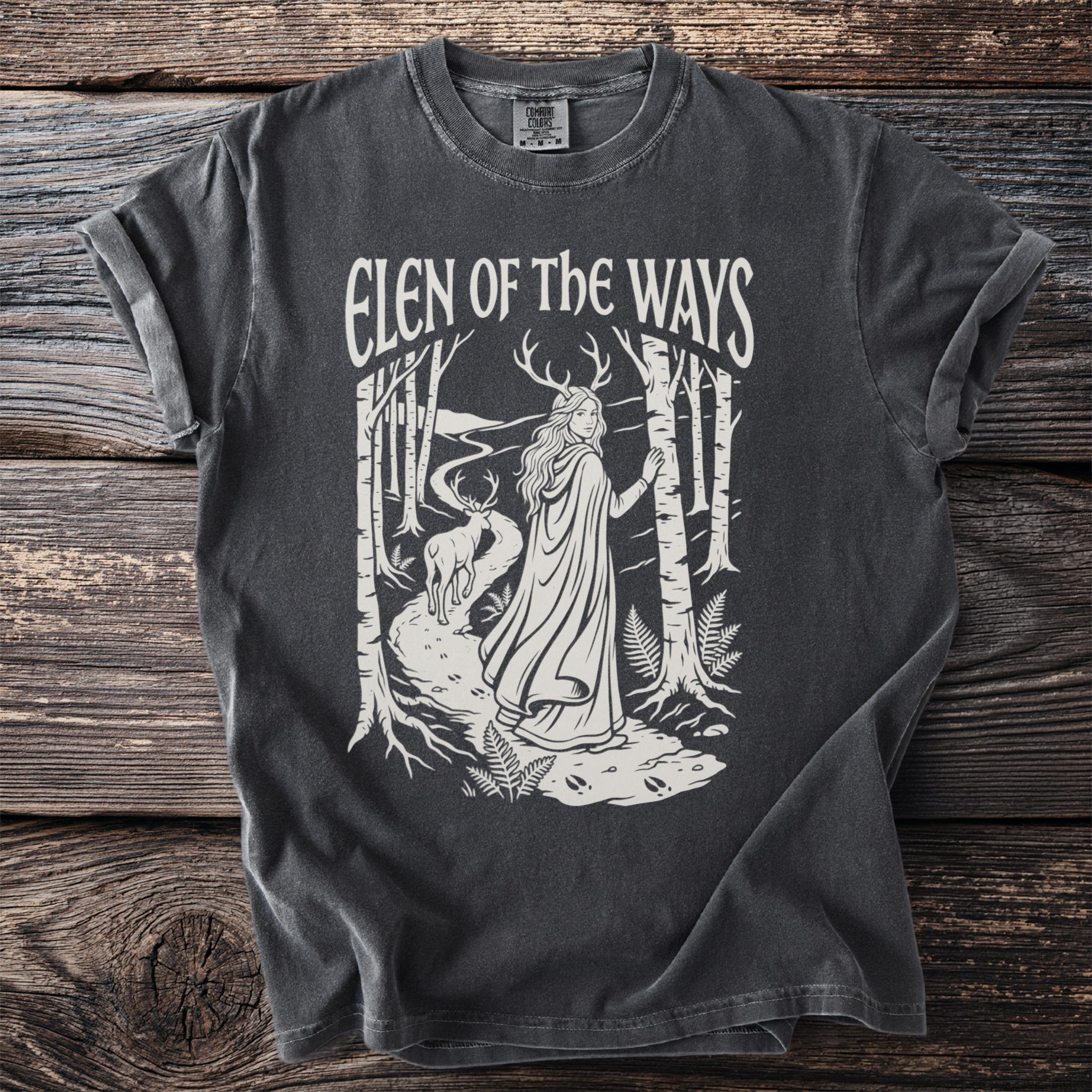 Dark grey t-shirt with "Elen of the Ways" text and a forest scene graphic.