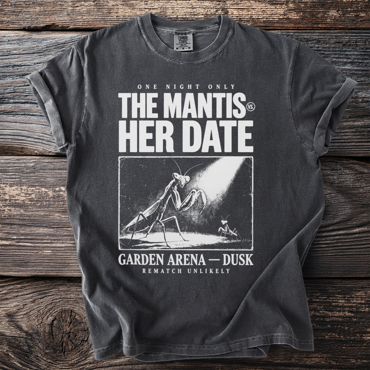 Dark t-shirt with "The Mantis vs. Her Date" graphic and text.