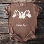 Brown Comfort Colors t-shirt with a white swan graphic and text "i have beef."