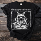 Black t-shirt with raccoon in trash can and "do not perceive me" text.
