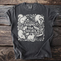 Dark t-shirt with white wildlife illustration and text "respect the locals."
