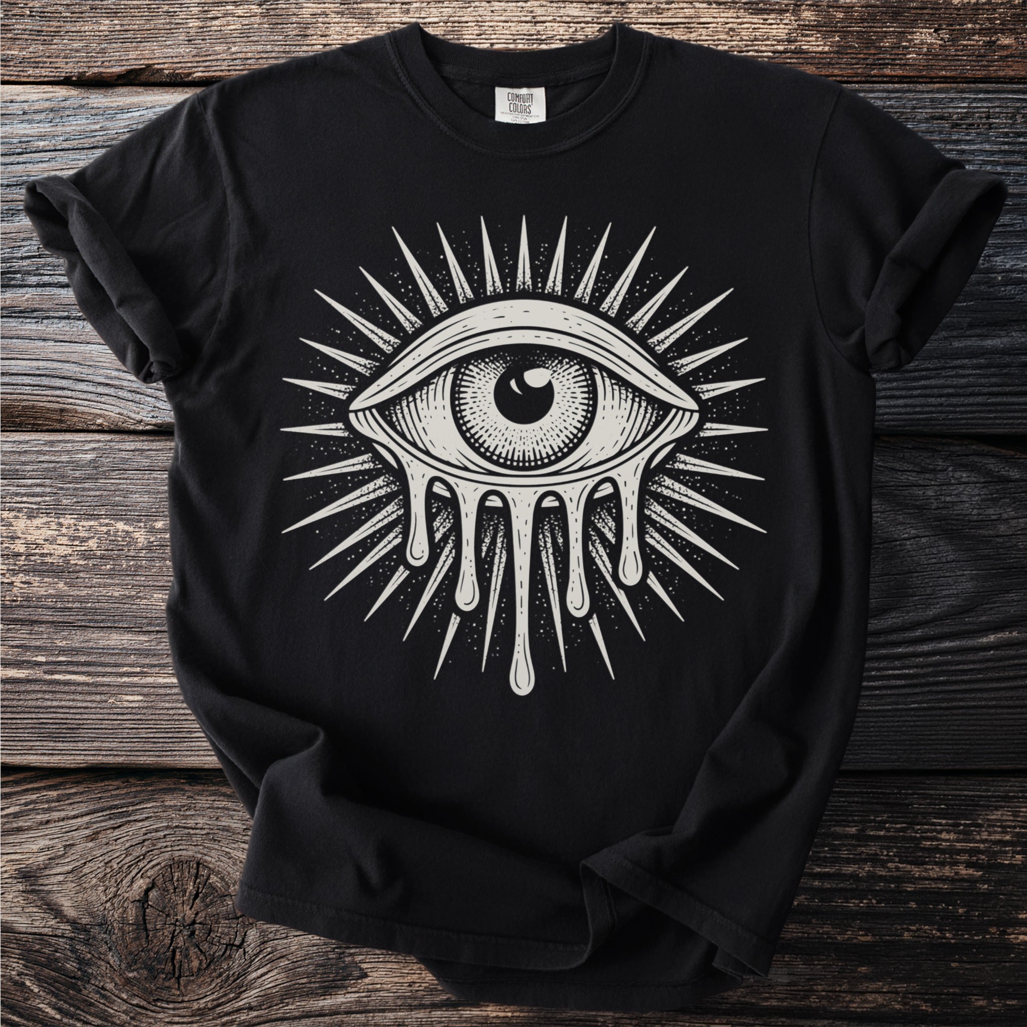 Black t-shirt with a white dripping eye design surrounded by rays.