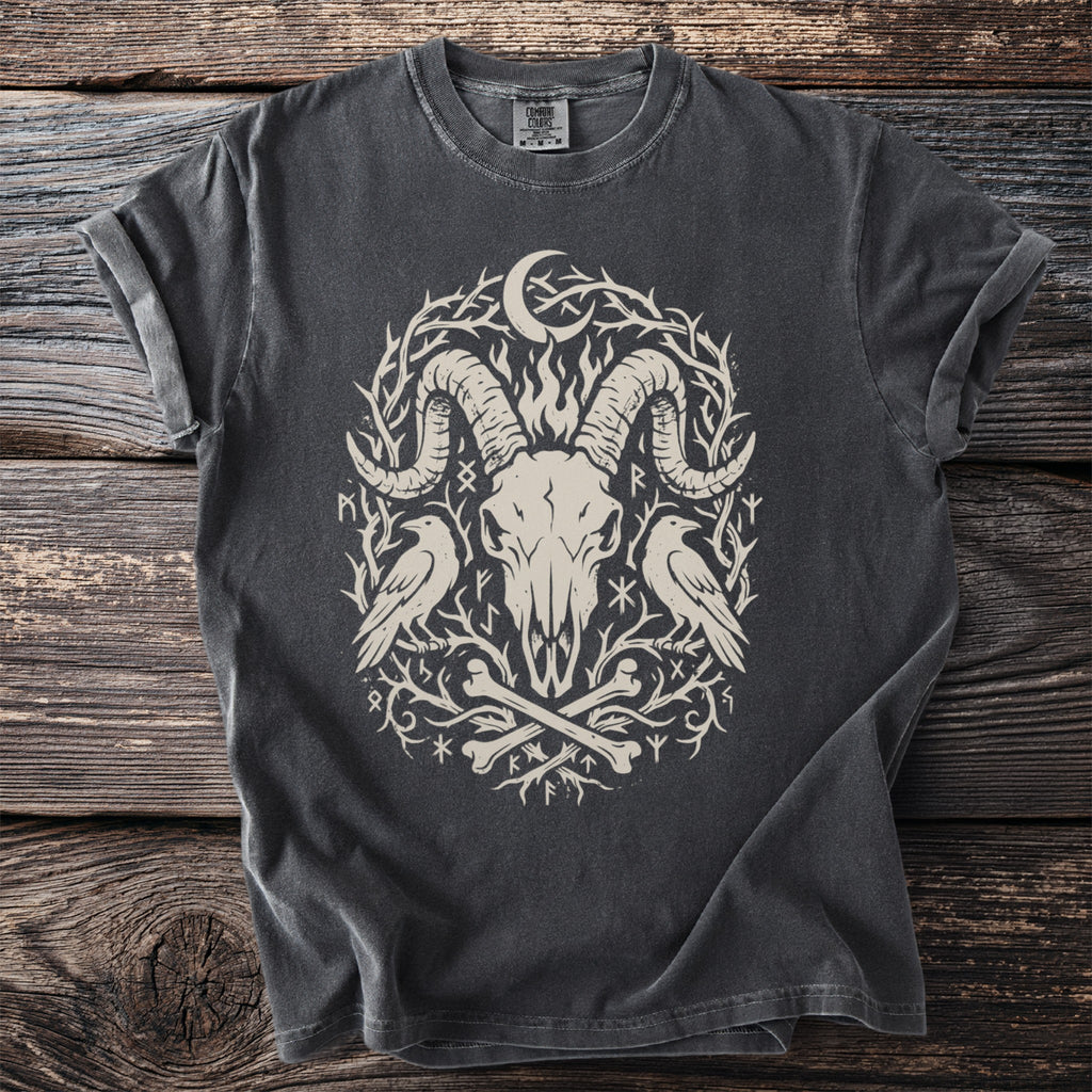 Dark grey t-shirt with a distressed graphic of a ram skull, two ravens, bones, and runes.