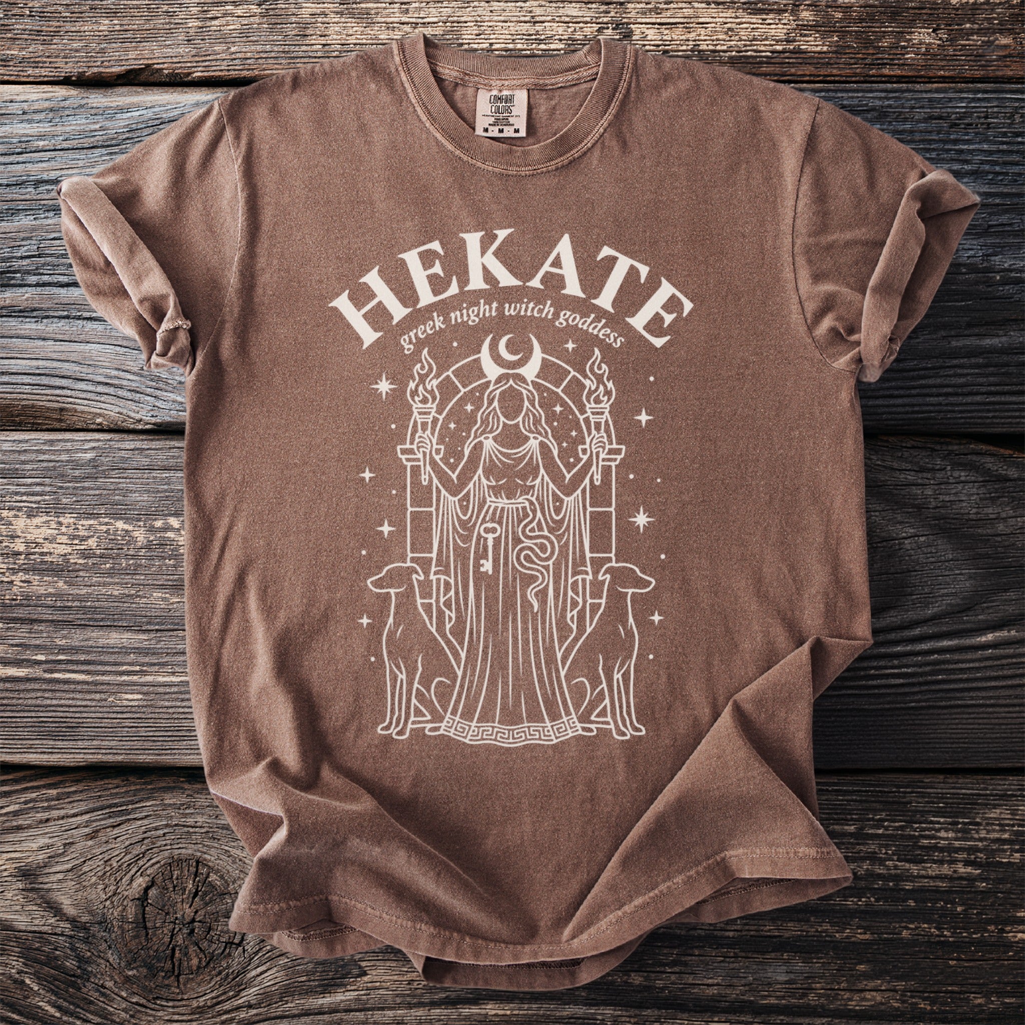 Brown t-shirt with "Hekate greek night witch goddess" and illustration.