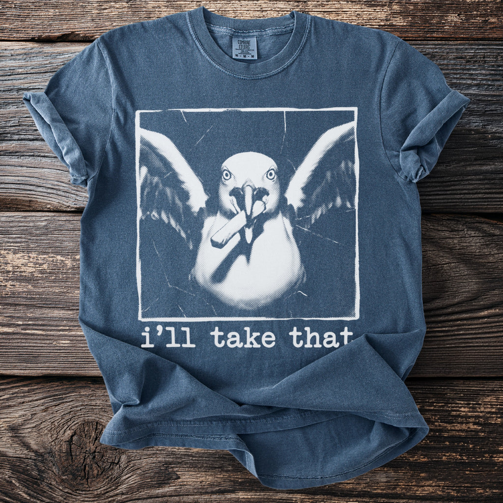 Blue t-shirt with a white graphic of a bird holding a cigarette and text that reads "i'll take that".