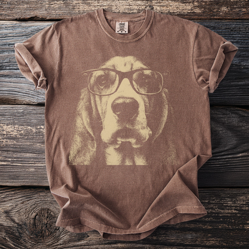 Brown t-shirt with a distressed print of a basset hound wearing glasses.