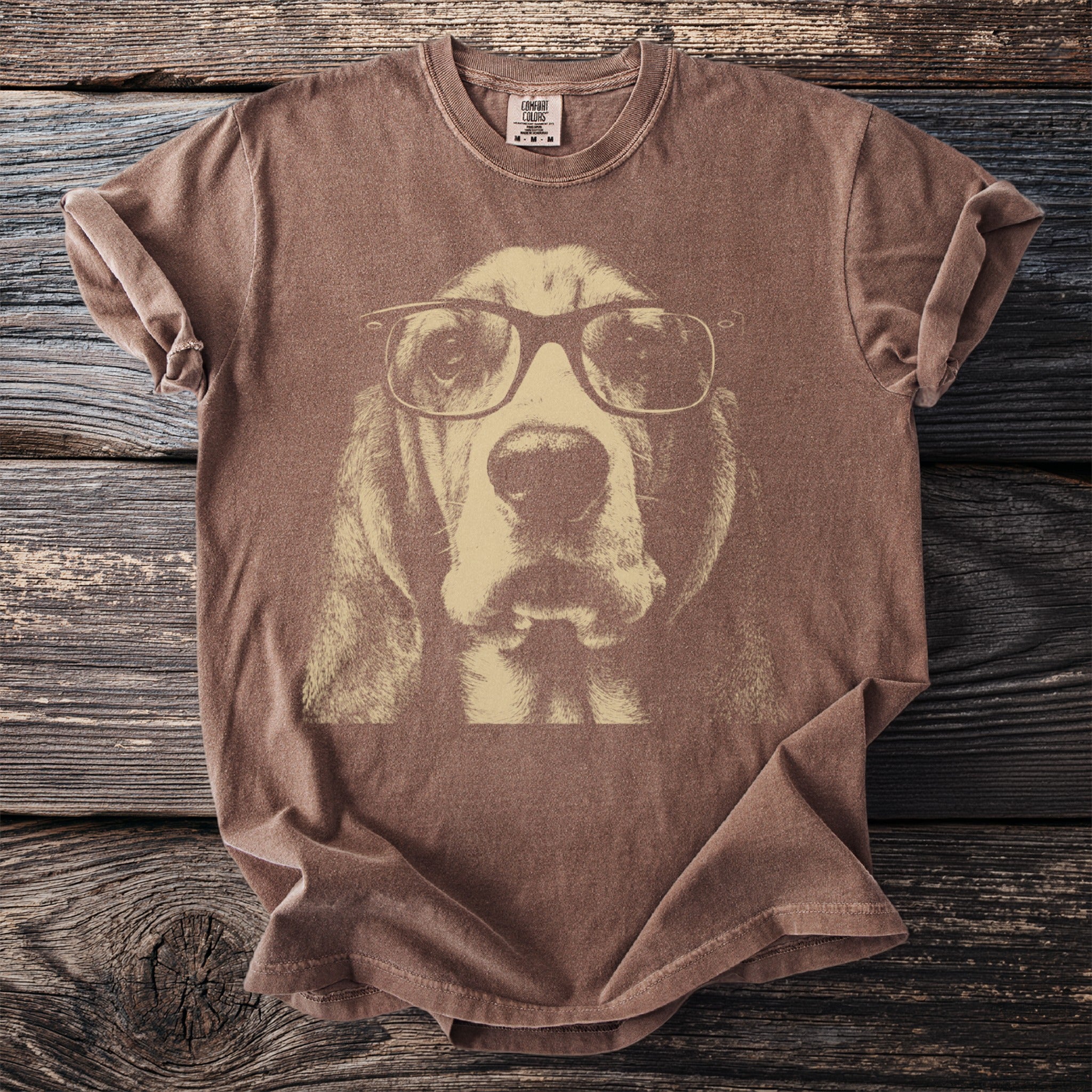 Brown t-shirt with a distressed print of a basset hound wearing glasses.