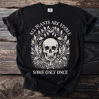 Black t-shirt with text and skull design: "ALL PLANTS ARE EDIBLE SOME ONLY ONCE"