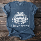 Blue t-shirt with a distressed toad graphic and the text "i have warts".