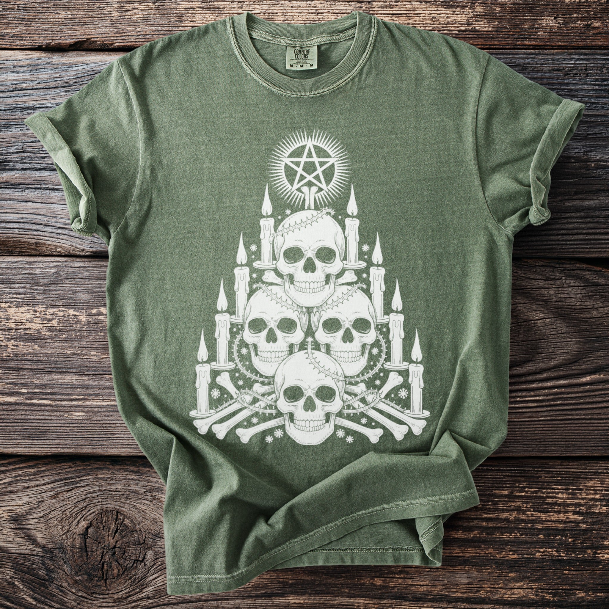 Green t-shirt with white occult skull and candle design and Comfort Colors tag.