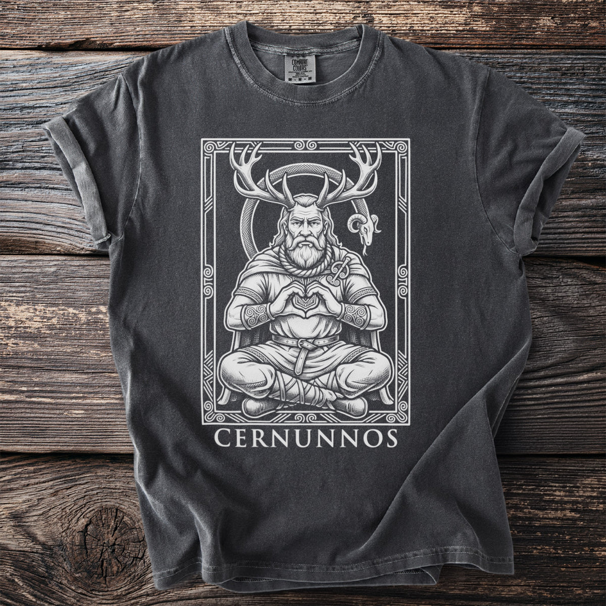 Dark t-shirt with a white outline design of Cernunnos with antlers and a ram.
