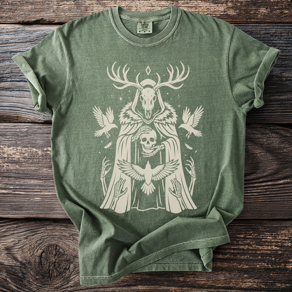 Green t-shirt with a beige distressed print of a skull-headed figure holding a skull.